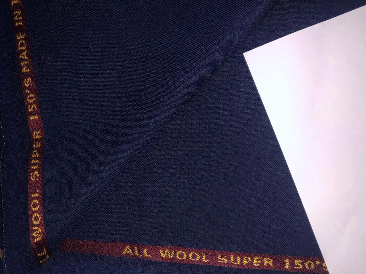 Suiting Superfine blended 70% poly 30% wool  58" wide  available in 5 colors silver grey, grey, navy, denim blue,ink blue